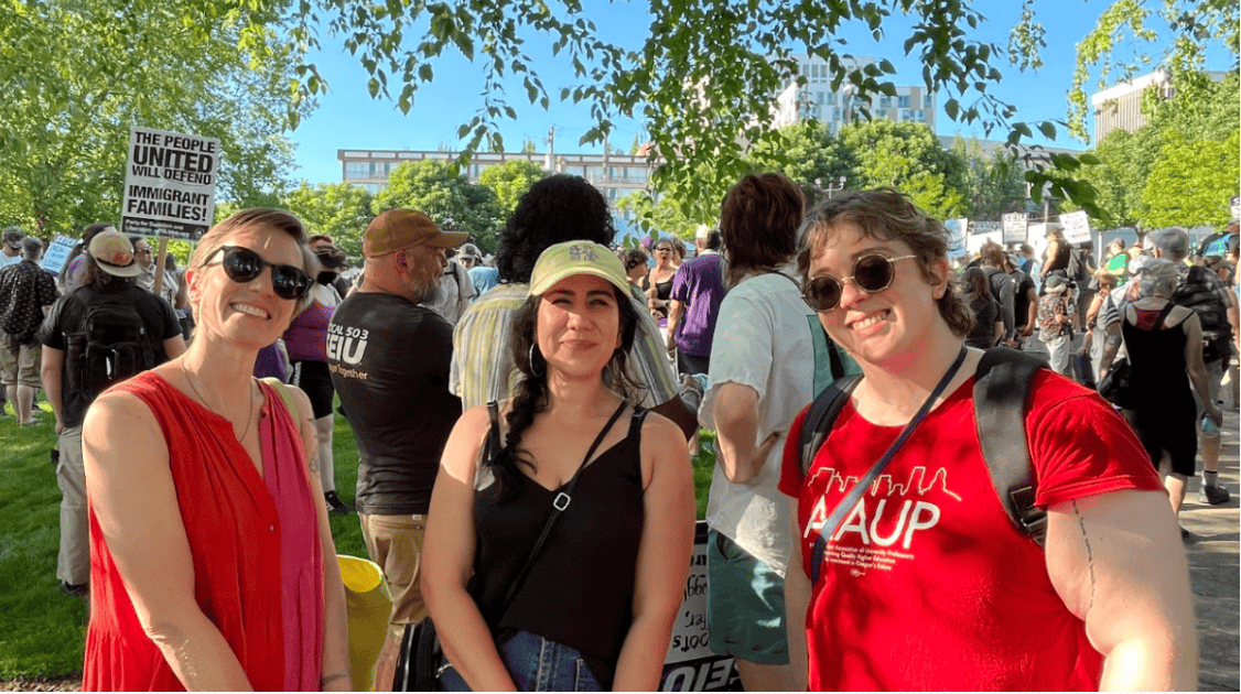 People posing with group in background