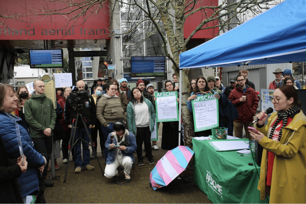 group gathered around a speaker