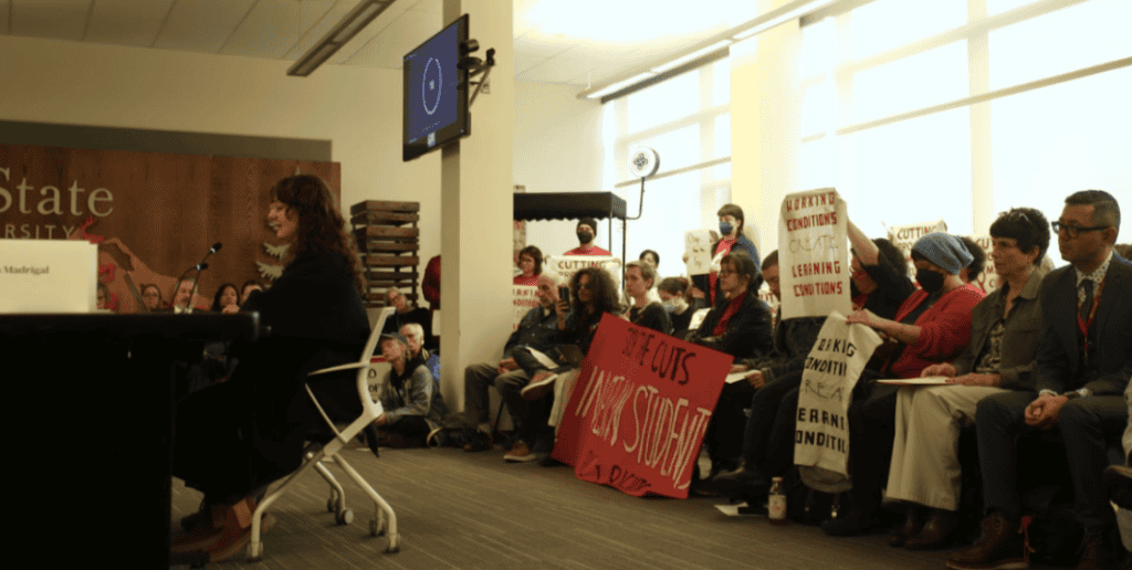 Person sitting with group behind them