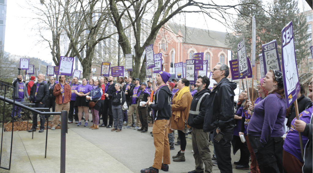 group of people holding signs