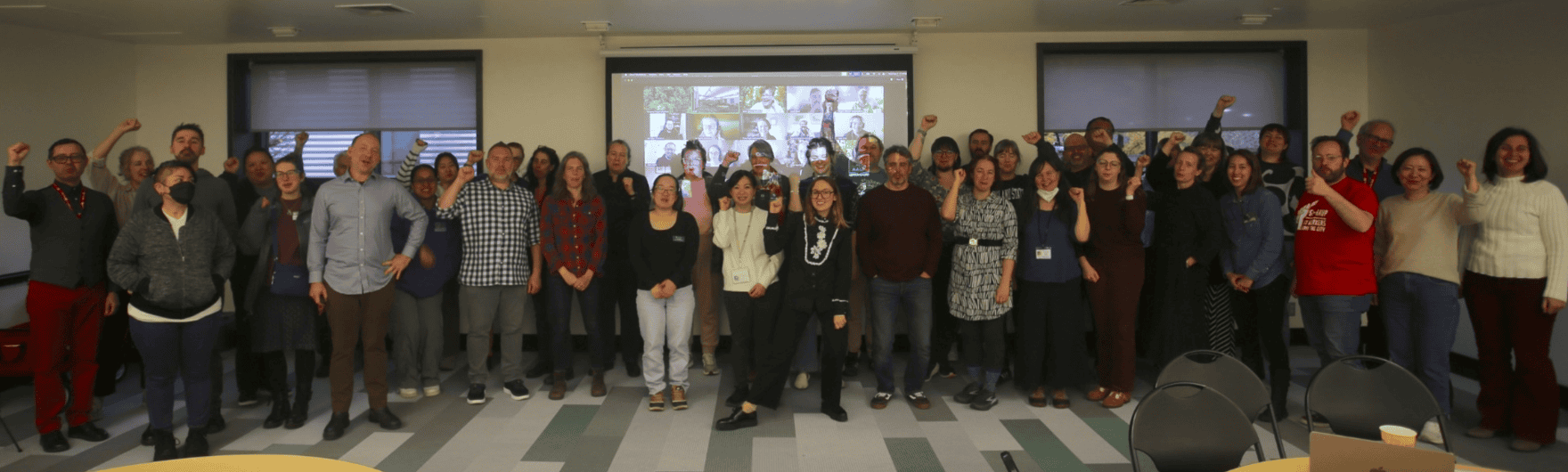 Group of people posing with fists in the air
